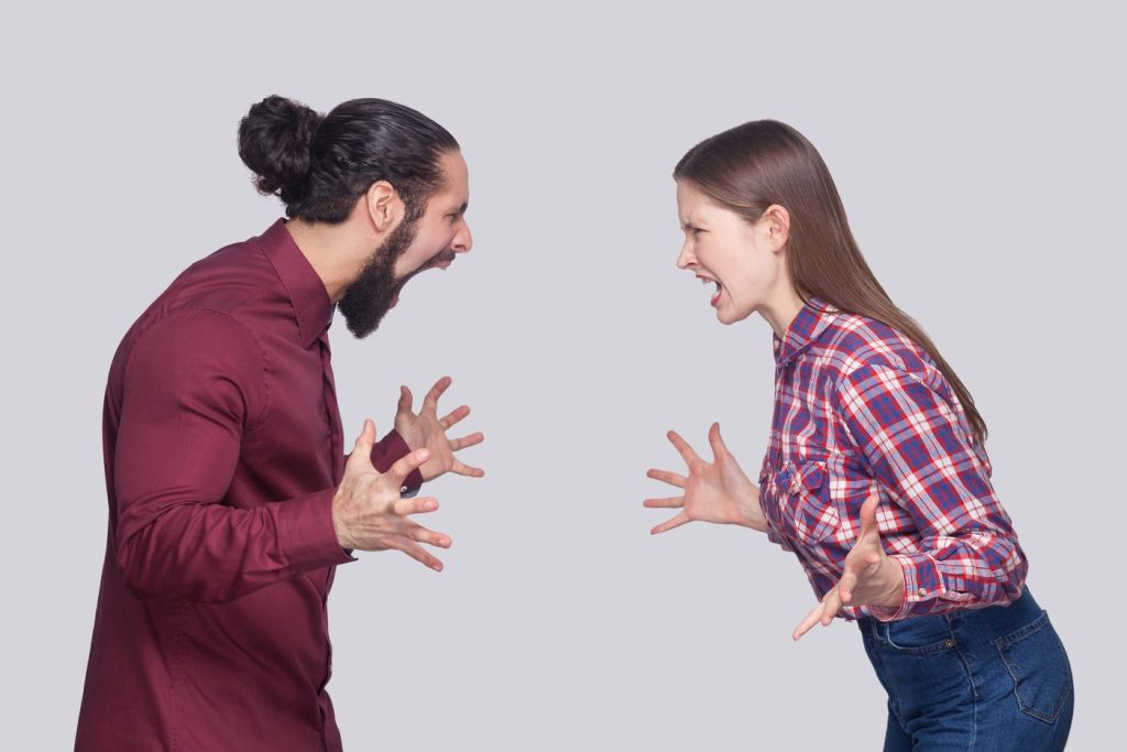 man and woman in a bad mood, angry and screaming at each other, demonstrating that it's a bad idea dating when you're in a bad mood