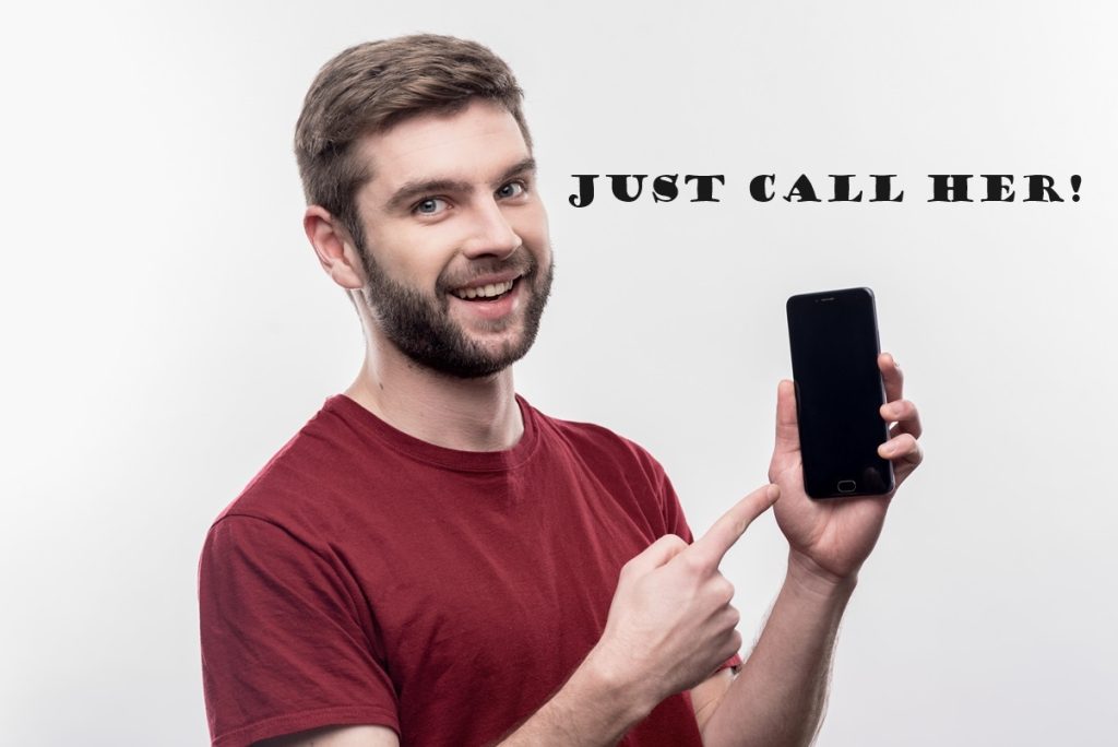 young man pointing at the phone with a text above phone saying "Just call her!"